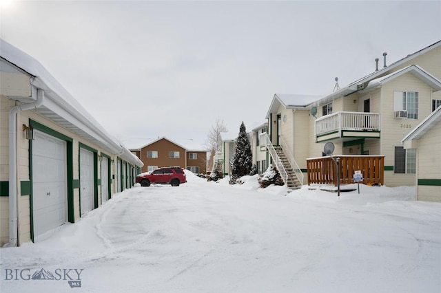 exterior space featuring cooling unit and a garage