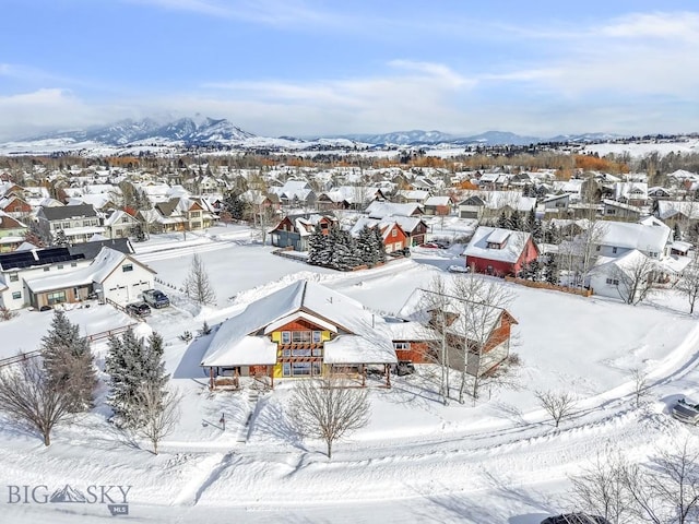 snowy aerial view with a mountain view