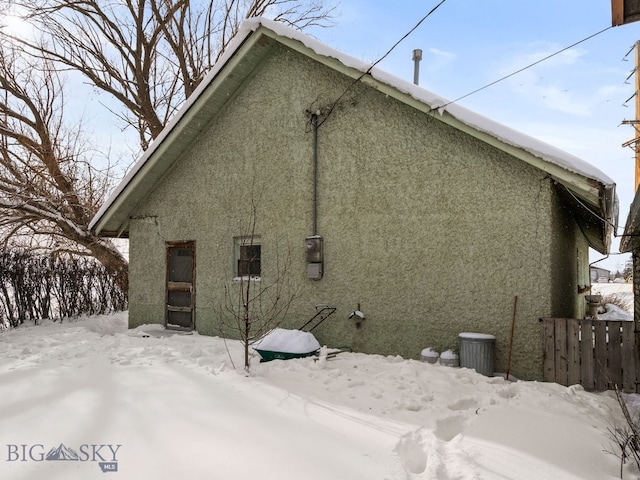 view of snow covered property