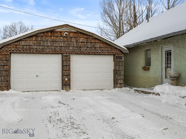 view of snow covered garage