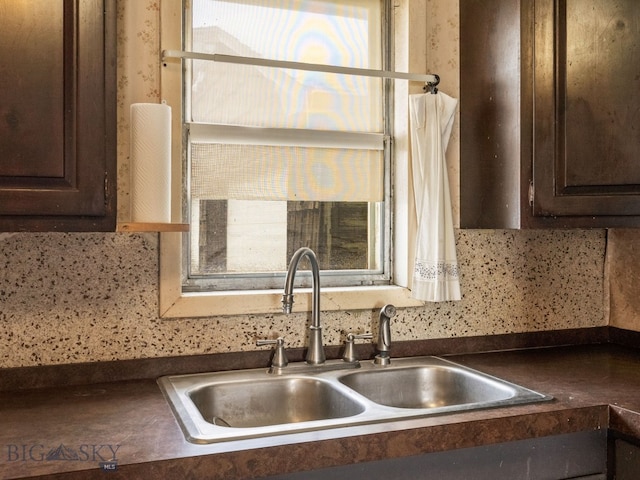 509 E Railroad N, Manhattan, MT 59741 - kitchen featuring a sink, dark brown cabinets, and dark countertops