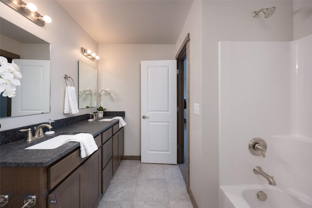 bathroom featuring tile patterned floors, shower / bath combination, and vanity