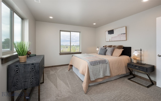 bedroom featuring light colored carpet