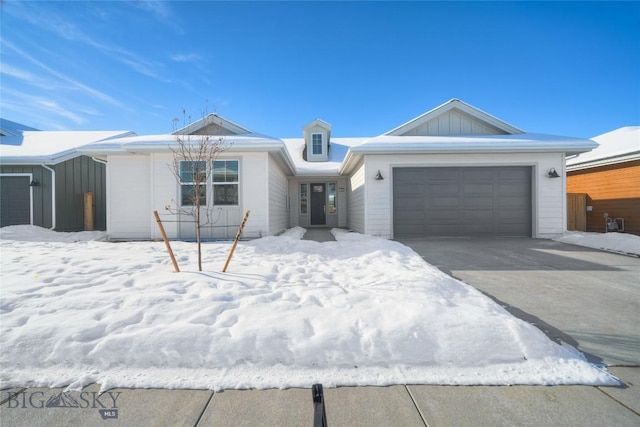 single story home featuring a garage