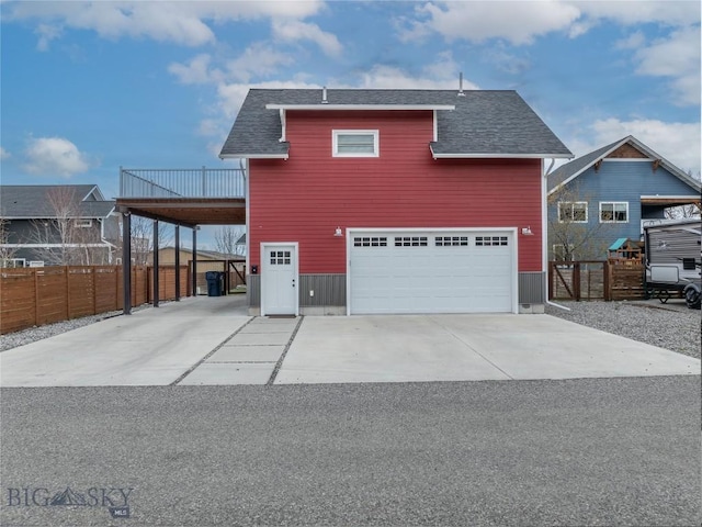 4562 Bembrick St, Bozeman, MT 59718 - view of front facade featuring fence, a shingled roof, and concrete driveway