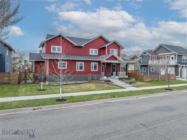 4562 Bembrick St, Bozeman, MT 59718 - view of front of property featuring a residential view, a shingled roof, a front yard, and fence