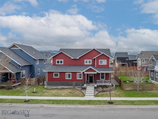 4562 Bembrick St, Bozeman, MT 59718 - townhome / multi-family property with fence, a shingled roof, a front lawn, and a residential view