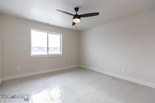 spare room with ceiling fan