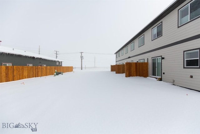 view of yard covered in snow