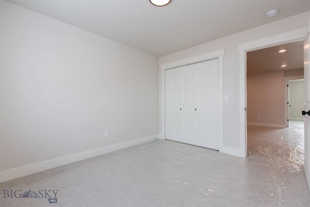 unfurnished bedroom with a closet