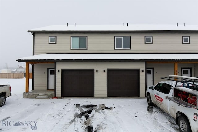 view of front of property featuring a garage