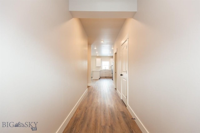 hallway featuring hardwood / wood-style flooring