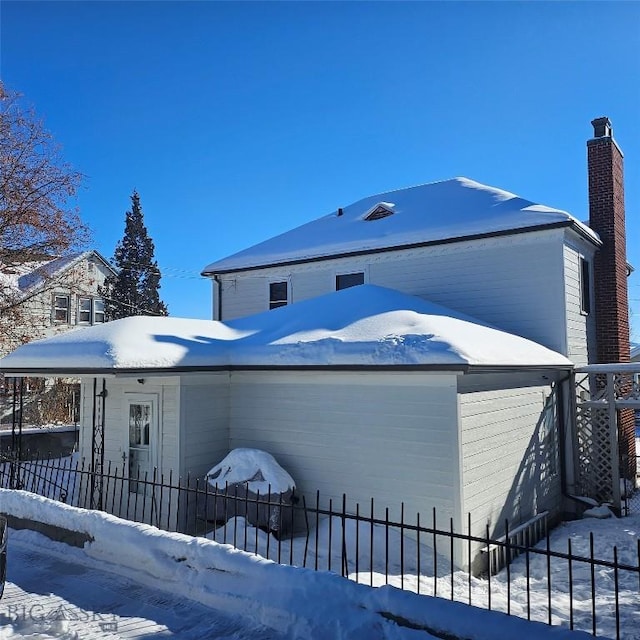 view of snow covered property