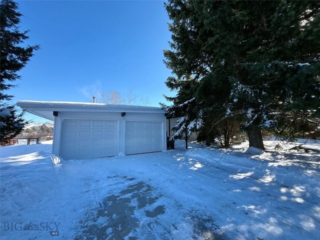 view of snow covered garage