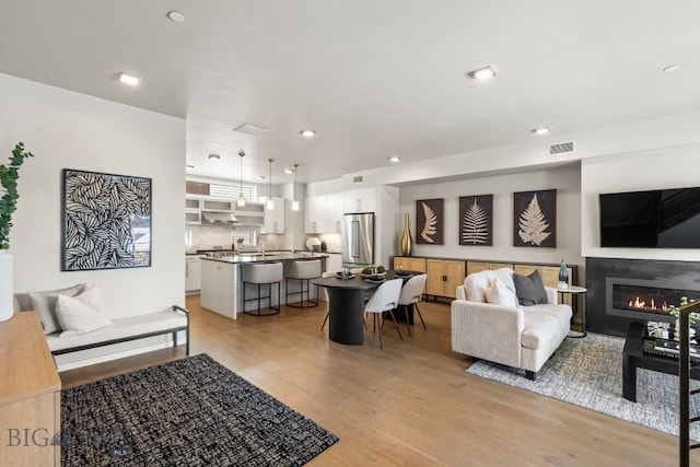 living room with light hardwood / wood-style flooring