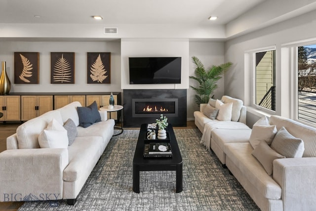 living room with dark hardwood / wood-style flooring