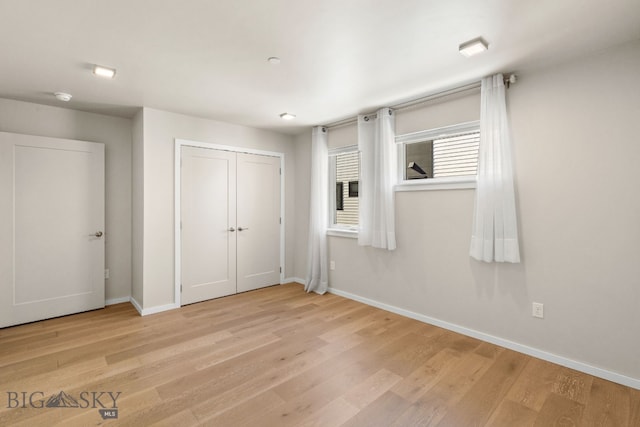 unfurnished bedroom with light hardwood / wood-style flooring