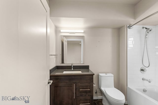 full bathroom with vanity, tiled shower / bath, and toilet