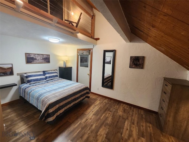 bedroom featuring lofted ceiling and dark hardwood / wood-style floors