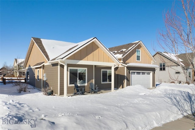 view of front of home featuring a garage and a porch