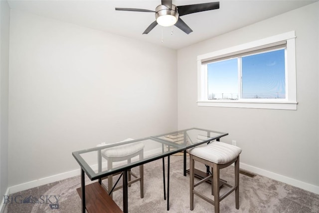 office area featuring light colored carpet and ceiling fan