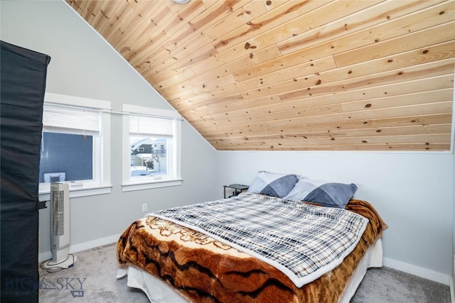 bedroom with wood ceiling, light colored carpet, and vaulted ceiling