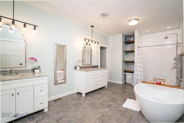 bathroom with vanity and separate shower and tub