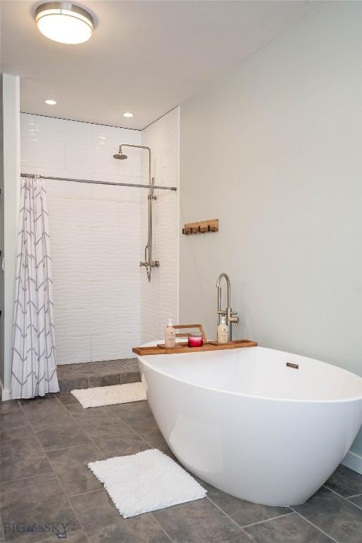 bathroom featuring separate shower and tub and tile patterned flooring