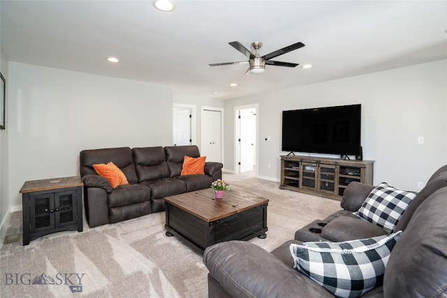 living room with light colored carpet and ceiling fan