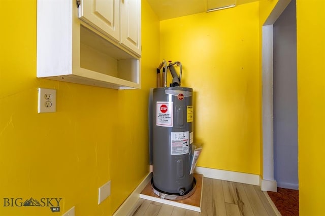 utility room featuring electric water heater