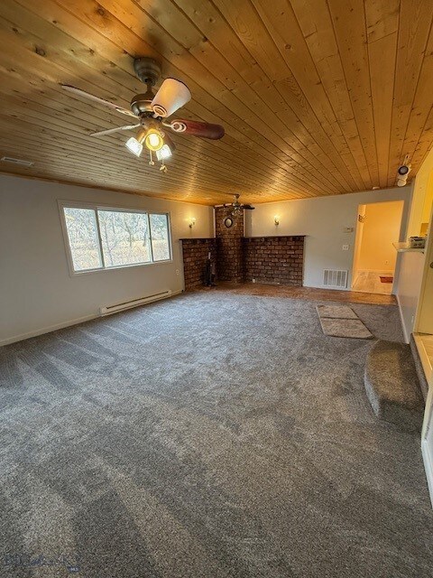5042 US Highway 89 S, Livingston, MT 59047 - unfurnished living room with wooden ceiling, a baseboard heating unit, a ceiling fan, carpet floors, and baseboards