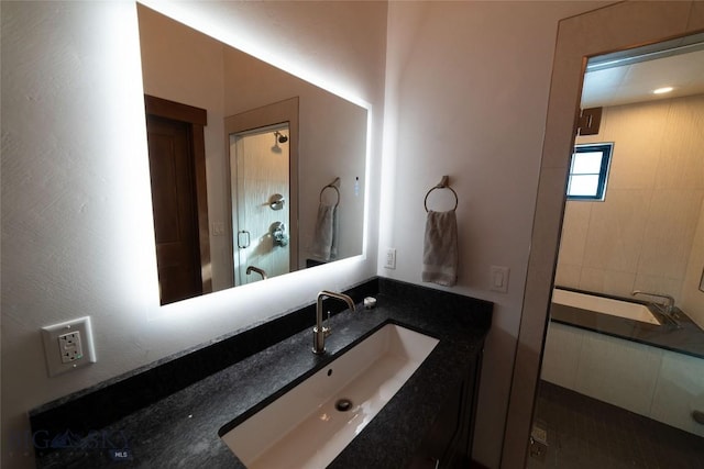 bathroom featuring vanity and walk in shower