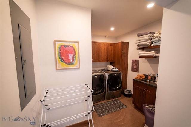 laundry area with cabinets, sink, and washing machine and dryer