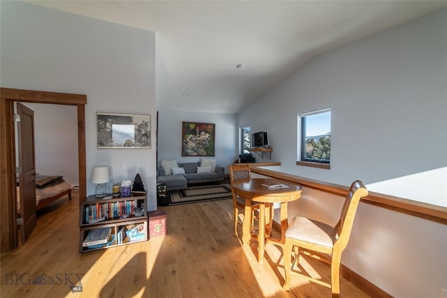 interior space with hardwood / wood-style floors and vaulted ceiling