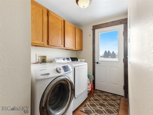 10 Fan Mountain Ct, Ennis, MT 59729 - clothes washing area featuring separate washer and dryer, cabinet space, a textured wall, and wood finished floors