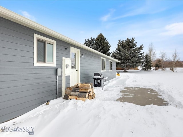 10 Fan Mountain Ct, Ennis, MT 59729 - view of snow covered back of property