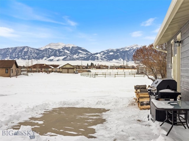 10 Fan Mountain Ct, Ennis, MT 59729 - snowy yard with a mountain view and fence