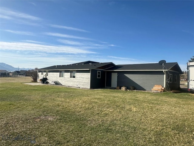 10 Fan Mountain Ct, Ennis, MT 59729 - view of side of home featuring a lawn and a patio area