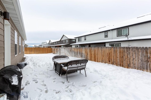 view of yard layered in snow