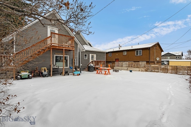 view of snow covered house