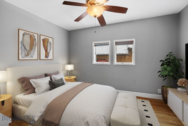 bedroom featuring ceiling fan and light hardwood / wood-style floors