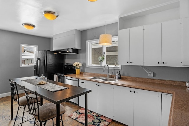 kitchen featuring black appliances, sink, white cabinets, and decorative light fixtures