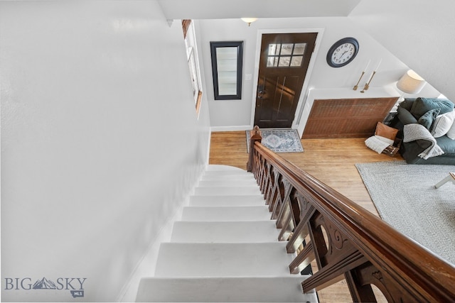 stairway featuring hardwood / wood-style flooring