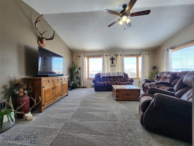 carpeted living room with lofted ceiling and ceiling fan