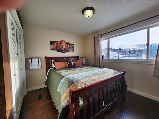 bedroom featuring dark hardwood / wood-style flooring