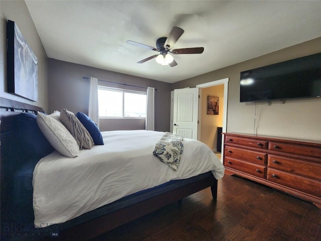 bedroom featuring dark hardwood / wood-style floors and ceiling fan