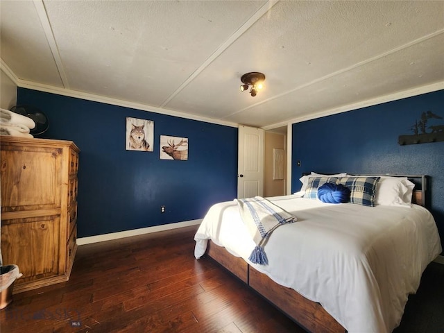 bedroom with dark hardwood / wood-style flooring