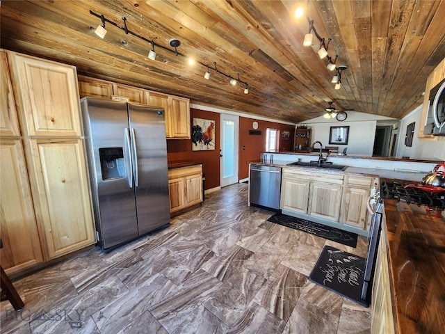 kitchen with light brown cabinetry, stainless steel appliances, lofted ceiling, wooden ceiling, and sink