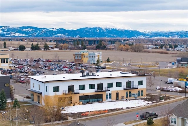 birds eye view of property with a mountain view