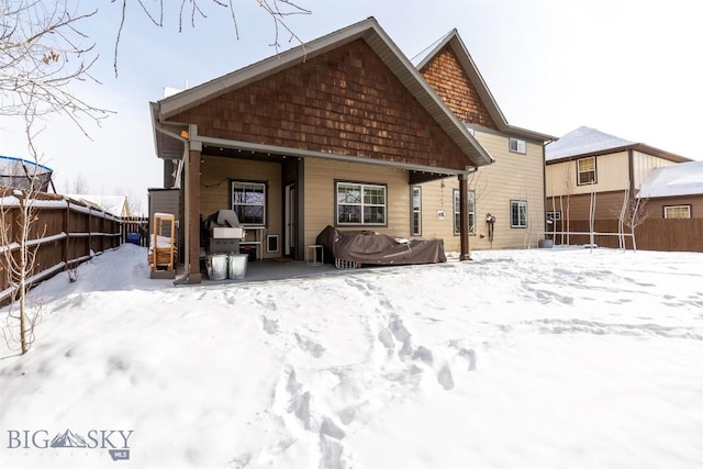 view of snow covered house